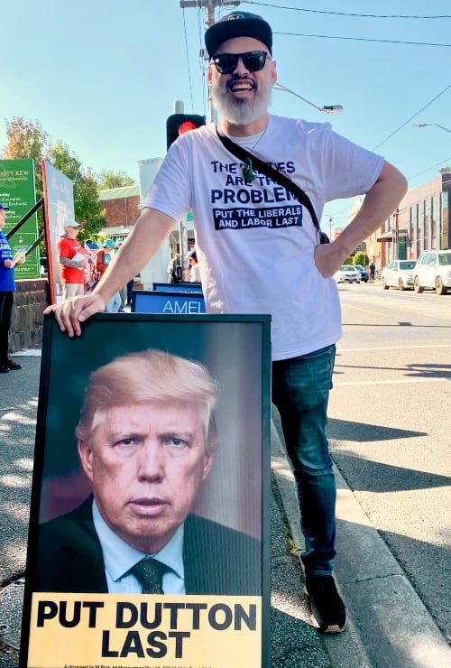 An election poster at a polling booth that says "Put Dutton Last"